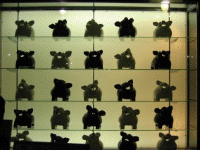 window of many little pig statues